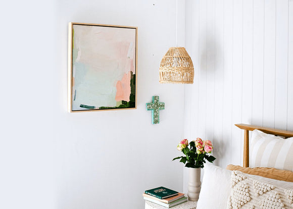 Coastal boho style bright master bedroom with modern pastel Australian art