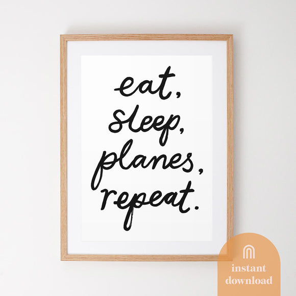 Aviation Plane themed kids downloadable art poster framed on wall featuring the hand lettered phrase 'Eat, sleep, planes, repeat'