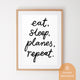 Aviation Plane themed kids downloadable art poster framed on wall featuring the hand lettered phrase 'Eat, sleep, planes, repeat'