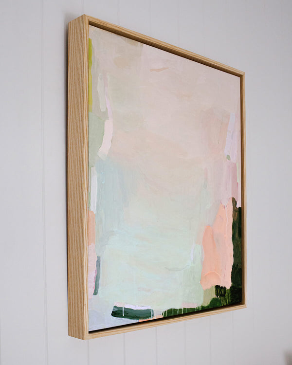 Modern soft green, blush pink and peach colours of a modern Australian abstract artwork framed in oak