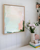 Pretty office styled with fresh flower arrangement and pastel abstract artwork on VJ panel wall
